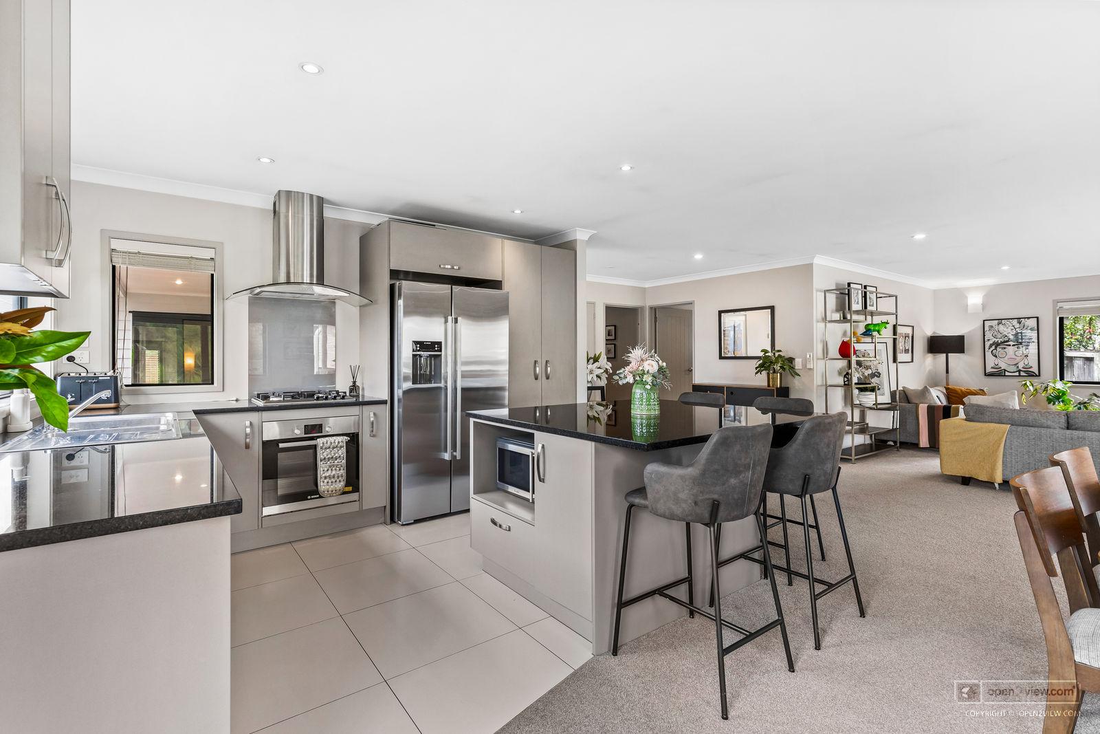 Slider image of 7 Wautaiti Drive, Auckland